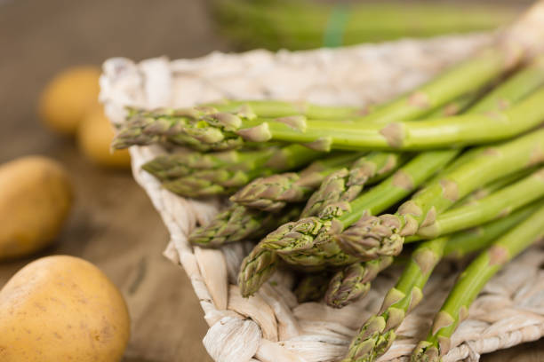 Green asparagus Green asparagus and some potatoes asparagus organic dinner close to stock pictures, royalty-free photos & images