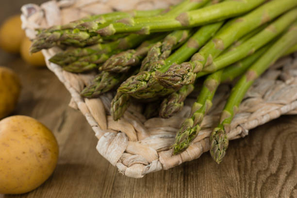 Green asparagus Green asparagus and some potatoes asparagus organic dinner close to stock pictures, royalty-free photos & images