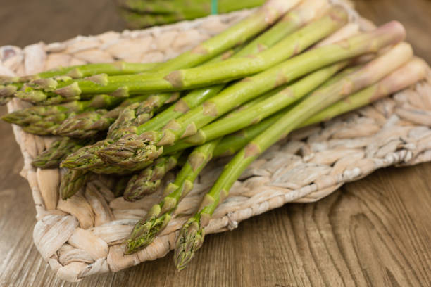 Green asparagus Fresh, green asparagus in a basket asparagus organic dinner close to stock pictures, royalty-free photos & images