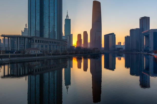 istock River And Modern Buildings Against Sky at dusk 670678366
