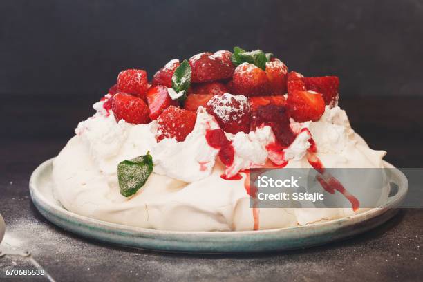 Delicious Pavlova Cake With Strawberries And Cranberry Sauce Stock Photo - Download Image Now