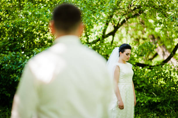 istock Gorgeus wedding couple on green sunny forest 670697030