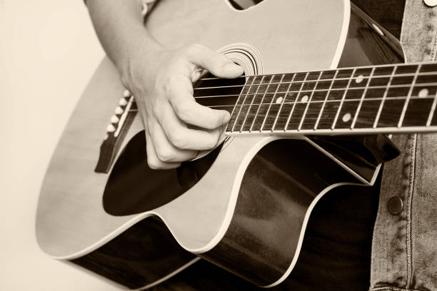 istock teenager playing guitar 670702008