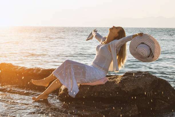 istock Happy woman enjoying summer 670702120