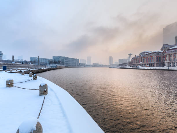 istock River And Modern Buildings Against Sky at dusk 670702406