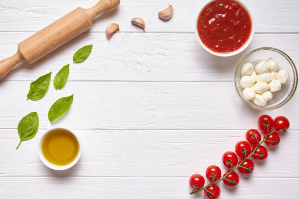 istock Rustic traditional Italian food background with empty copy design space on white wooden texture kitchen table 670702532