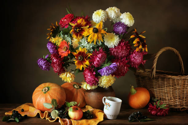 istock Still life with autumn flowers and pumpkins 670708754
