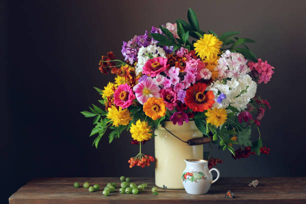 istock Still life with garden flowers in a can 670708912