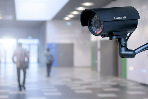 The concept of security through surveillance camera in the corporation or government building.
