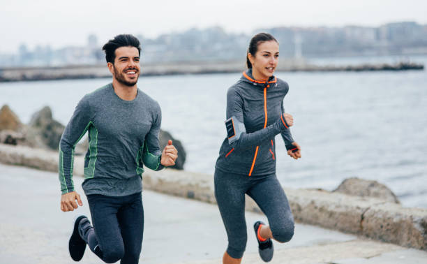 istock Friends jogging by the sea 670724086