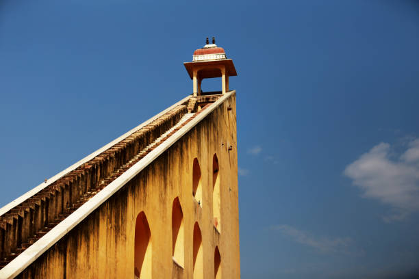 Stone instruments, Jantar Mantar Observatory, near City Palace, Jaipur, Rajasthan, India. Jantar Mantar is an assembly of stone-built astronomical instruments, designed to be used with the naked eye, situated near the City Palace. The palace was built by Maharaja Sawai Jai Singh ll in 1727. India displays a wealth of colour, vibrancy and imagery, none more so than in Jaipur, the Pink City, capital of Rajasthan state and named after the Maharaja painted it pink to welcome Edward, Prince of Wales, later King Edward V11