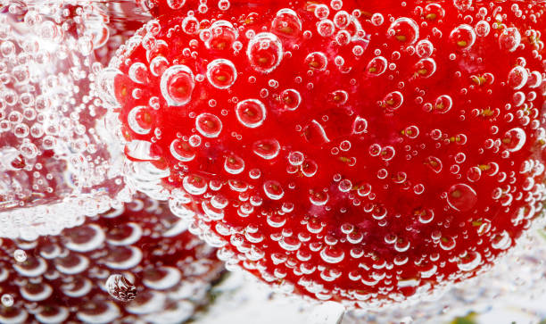 istock fresh strawberry in glass with sparkling water 670737654