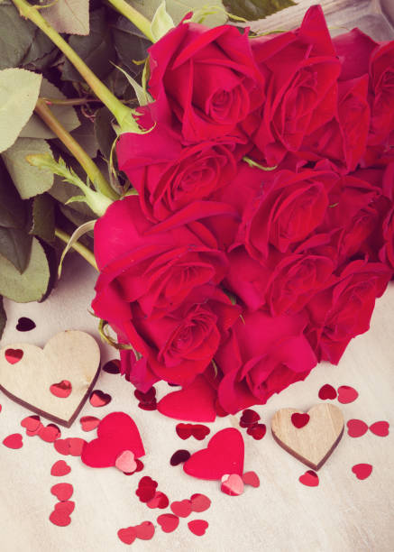 istock Small Valentine red hearts and fresh roses 670740382
