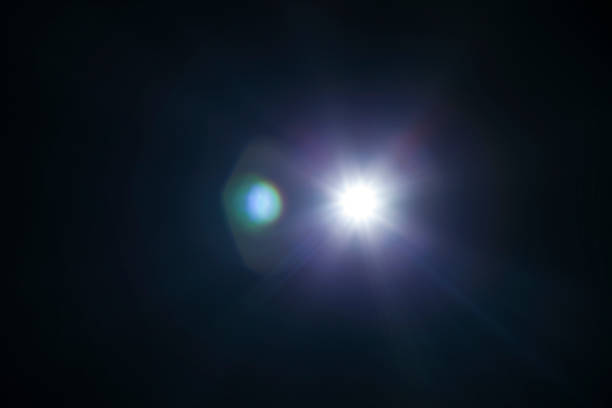 istock White light flare special effect in dark black. 670740460