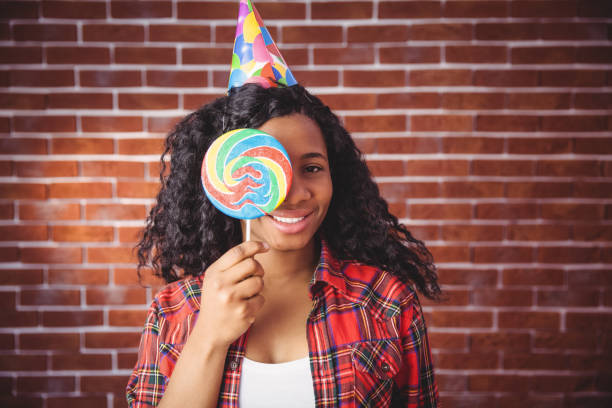 istock Cute model with hat and lollipop 670740502