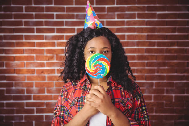 istock Cute model with hat and lollipop 670740752