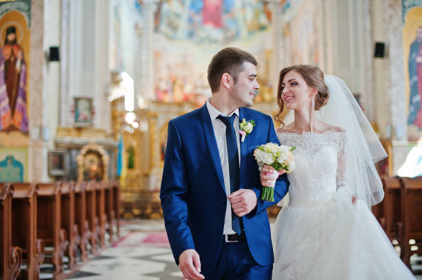 istock happy wedding couple after church ceremony 670744096
