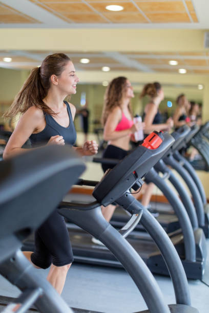 istock Women jogging on treadmill 670744334