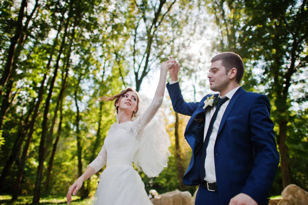 istock Dancing wedding couple background big stones 670745068