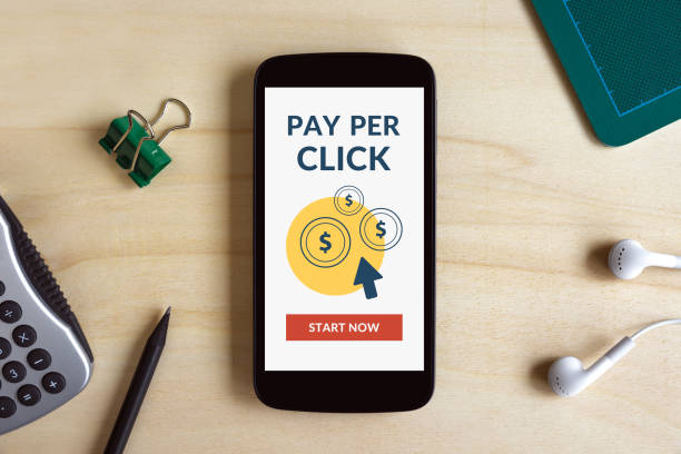 istock Pay Per Click concept on smart phone screen on wooden desk 670747854
