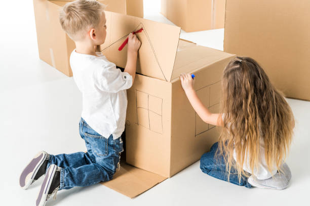 istock Kids drawing on cardboard box 670748680