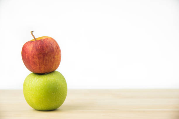 istock Green apple and red apples on white background. 670755832