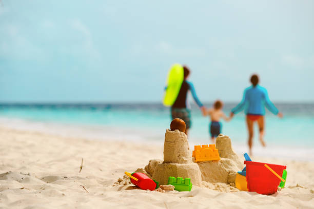 istock sand castle on tropical beach, family vacation 670756764