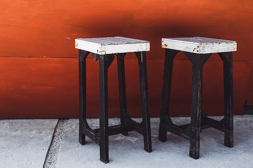 Vintage white bar stools on a red background