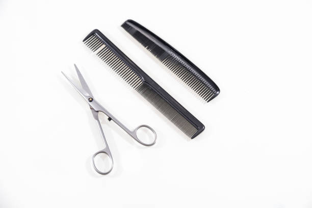 istock Hair cutting shears and comb isolated on white 670766606