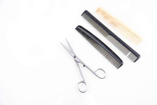 istock Hair cutting shears and comb isolated on white 670766912