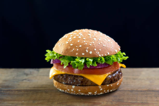 istock Burger with cheese, lettuce and tomato 670770410