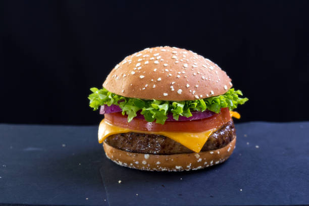 istock Burger with cheese, lettuce and tomato 670770492