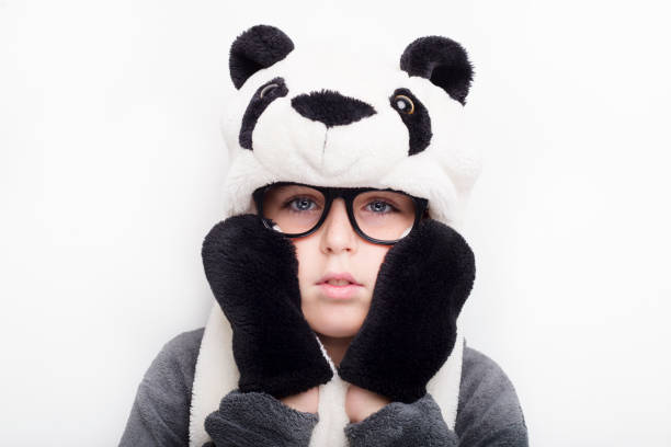 istock Handsome boy is wearing eyeglasses and panda hat. 670771742