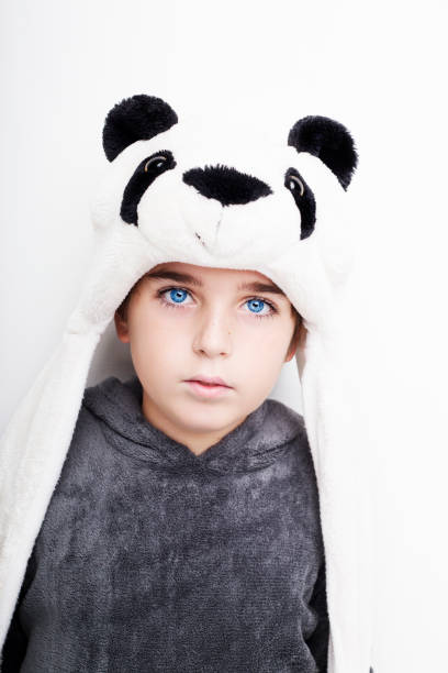istock Handsome boy is wearing eyeglasses and panda hat. 670771808