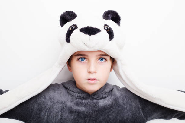istock Handsome boy is wearing eyeglasses and panda hat. 670773746