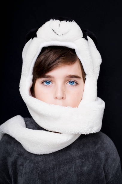Portrait of a handsome boy in panda hat
