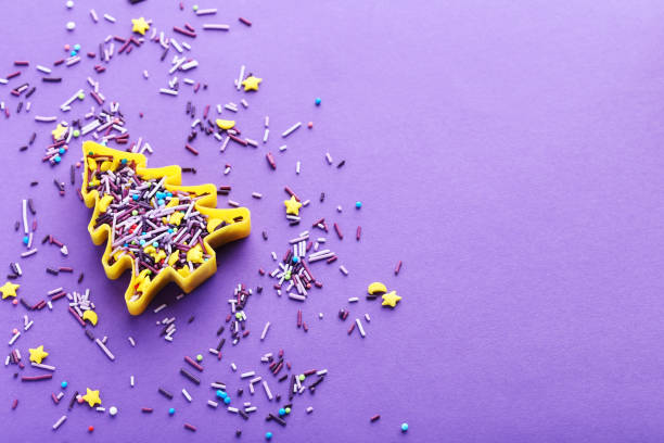 istock Colorful sprinkles on a purple background 670776152