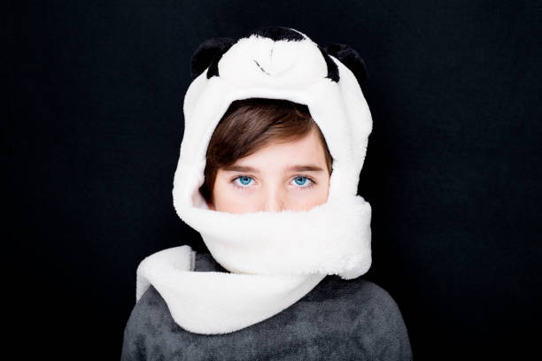 Portrait of a handsome boy in panda hat