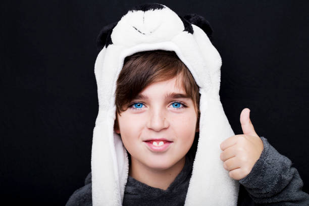 istock Portrait of a handsome boy in panda hat 670776346