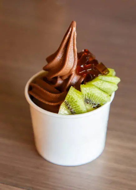 Photo of Yogurt chocolate  ice cream in takeaway paper cup