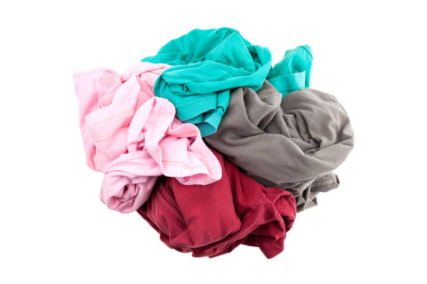 istock pile dirty clothes isolated on white background. 670776410