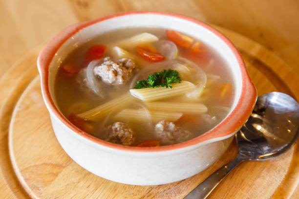 istock Soup pork chops with penne pasta bowl on wooden background 670776674