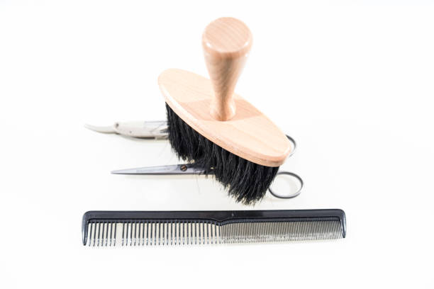 istock Hair cutting shears and comb isolated on white 670776724