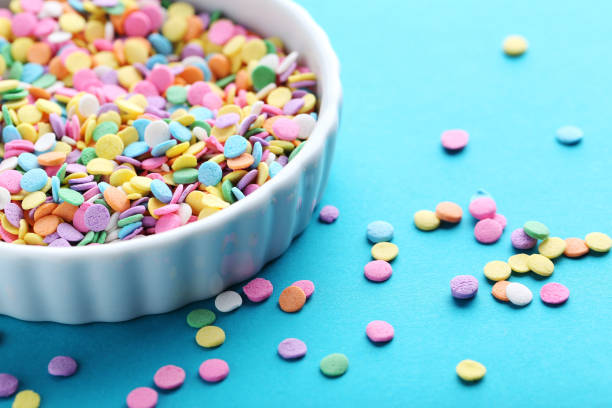 istock Colorful sprinkles on a blue background 670776988