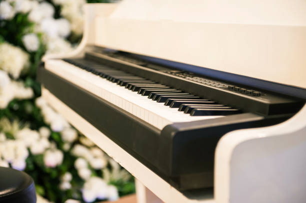 istock White piano in the garden. 670777278