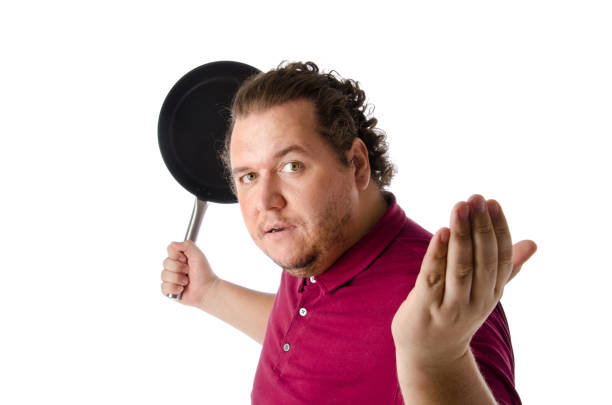 istock Cheerful funny cook. Kitchen tools. Fat guy. Laughter and joy. 670782592