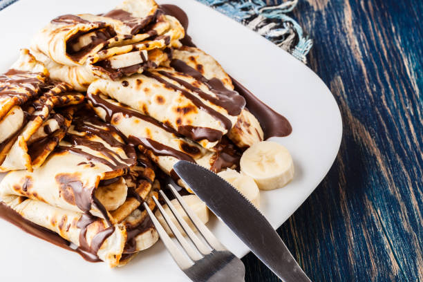 istock Crepes with banana and chocolate cream 670785988