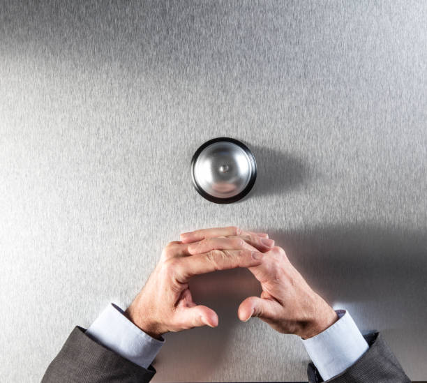 calm businessman crossing his hands next to a customer ring for patience and silence in management assistance, copy space, top view