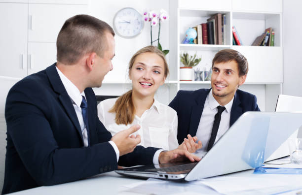 istock Coworkers chatting about business project 670796260
