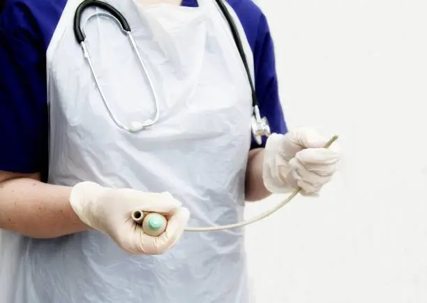 Nurse or Doctor holding a  urinary catheter